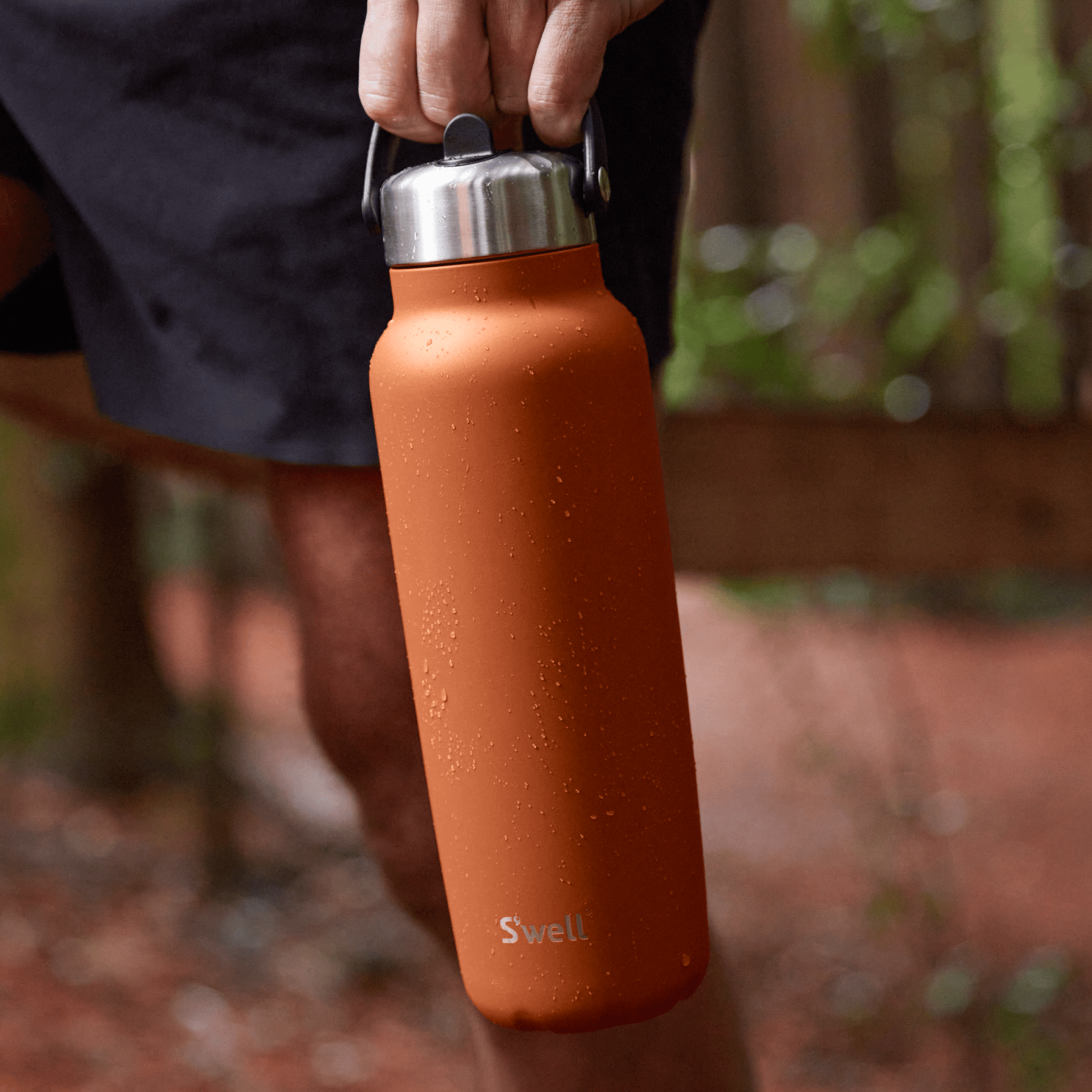explorer-with-flip-straw-lid-40oz-g7 Swell-Explorer-Water-Bottle-40oz-Orange-Carnelian-LifeStyle.png